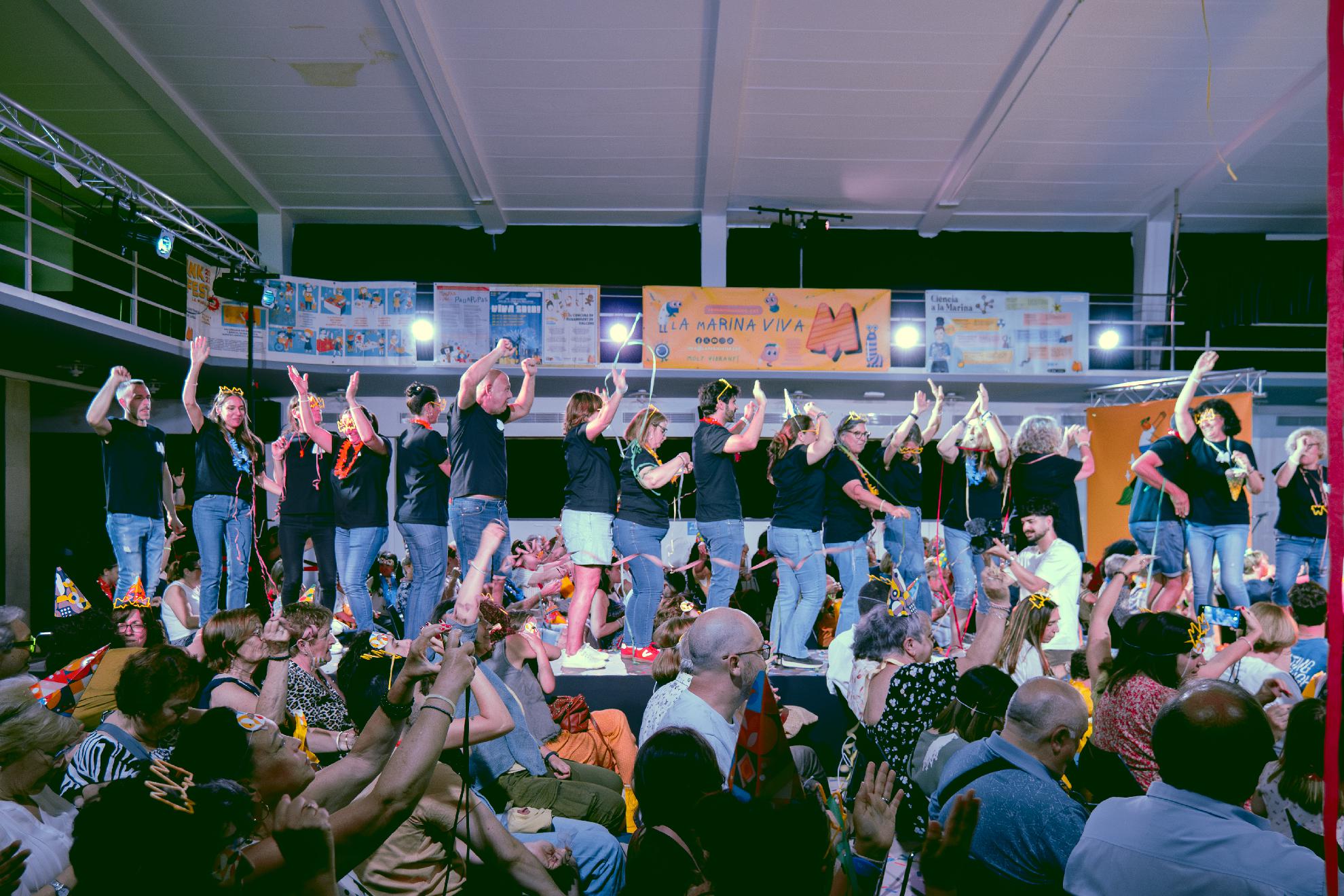 <h1><b>Gala del 15è aniversari de La Marina Viva</b><br></h1> <p> Celebrem el 15è aniversari de La Marina Viva amb més de 200 persones a la Sala Pepita Casanellas. Commemorem aquests 15 anys de servei i dinamització veïnal als barris de la Marina amb la projecció d’un documental que repassa la nostra història i les activitats, projectes i tallers més destacats que hem impulsat des de la nostra creació l’any 2011.</p><p class='btn-especial'>Més info</p>